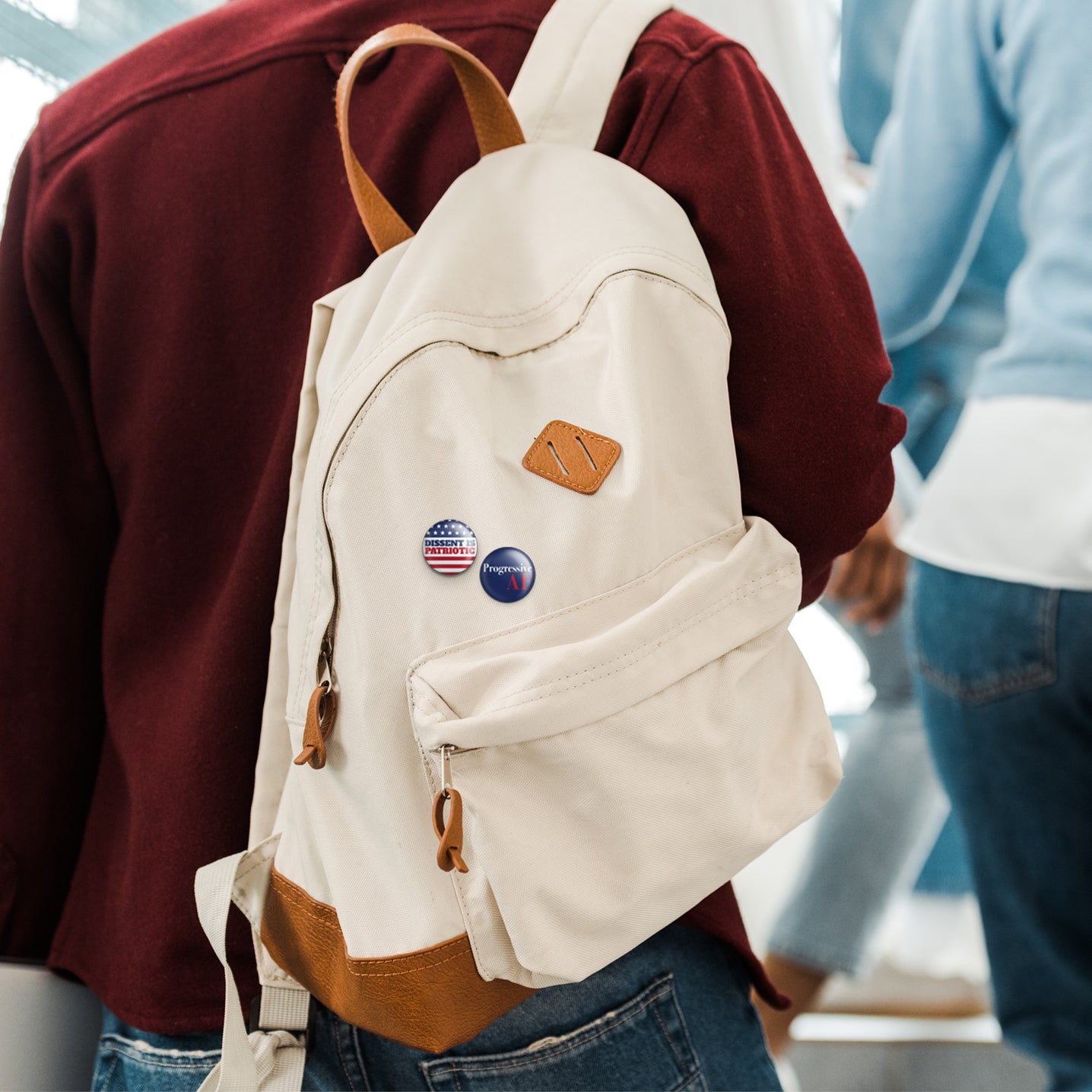 dissent is patriotic buttons on knapsack
